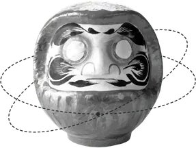 A daruma doll with its eyes still unpainted.